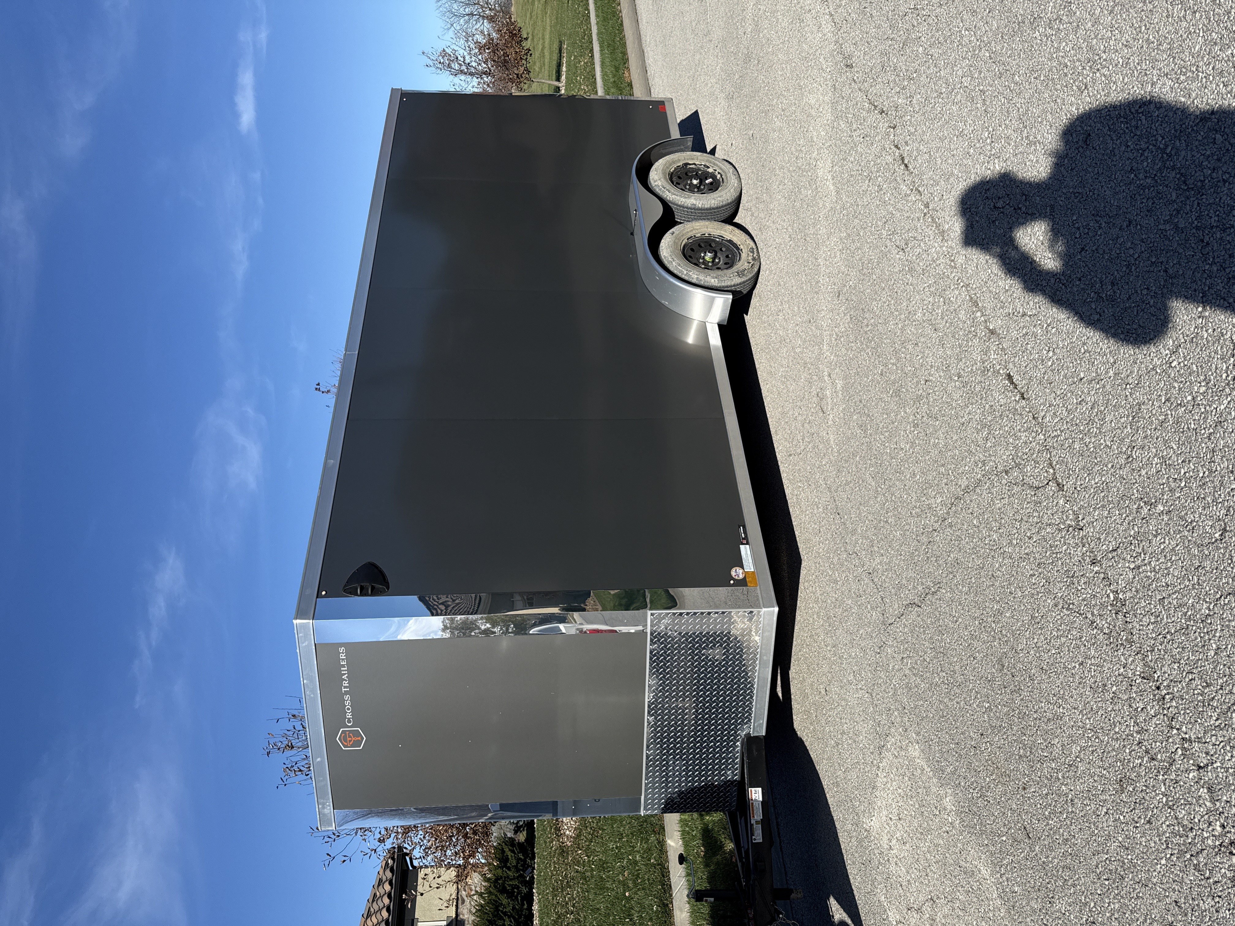 16 foot Cross Trailer Alpha enclosed cargo trailer for rent in Kansas City - exterior grey charcoal finish with dual axles