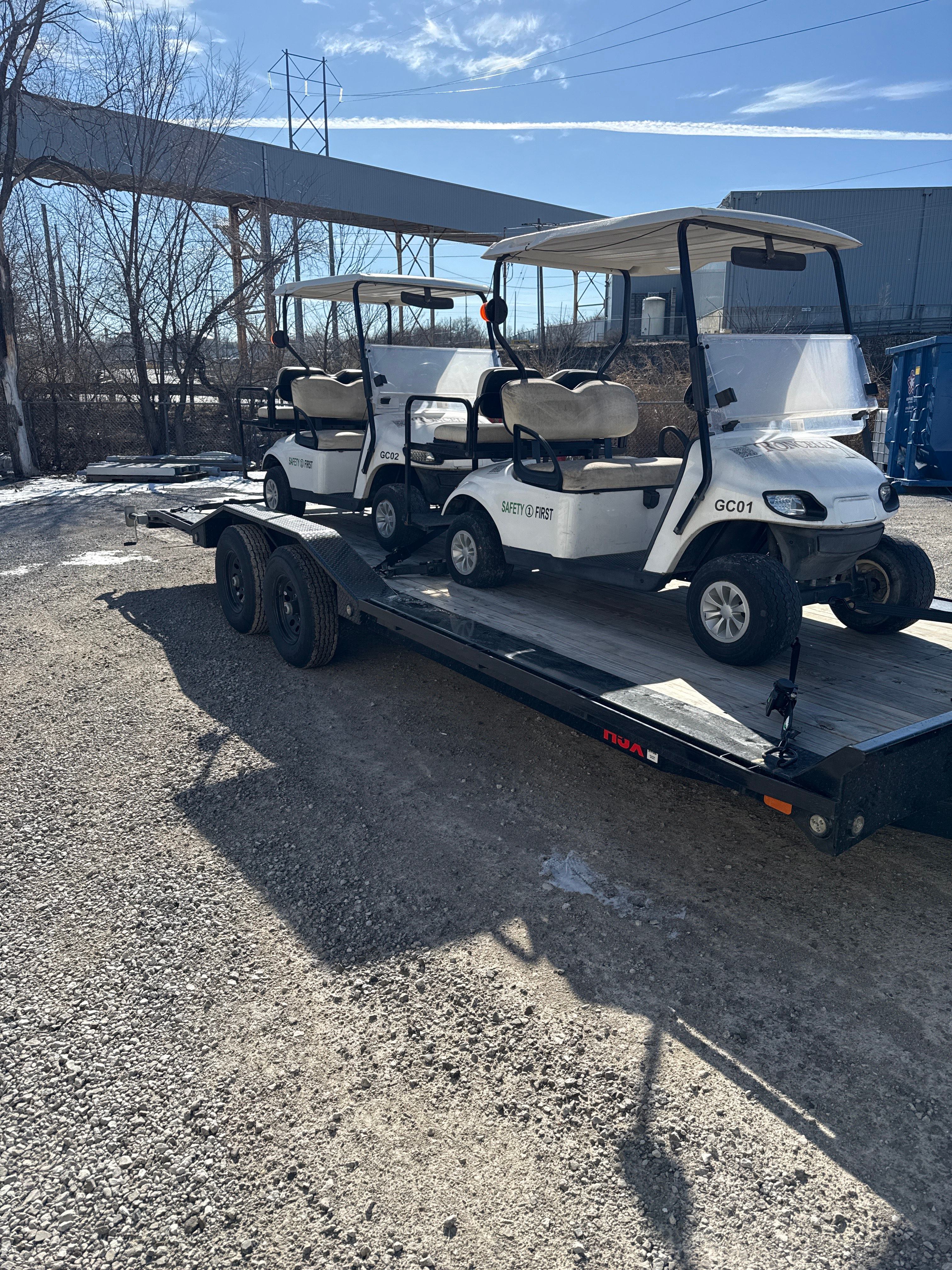 22ft flatbed car hauler loaded with golf carts demonstrating drive-over loading capability